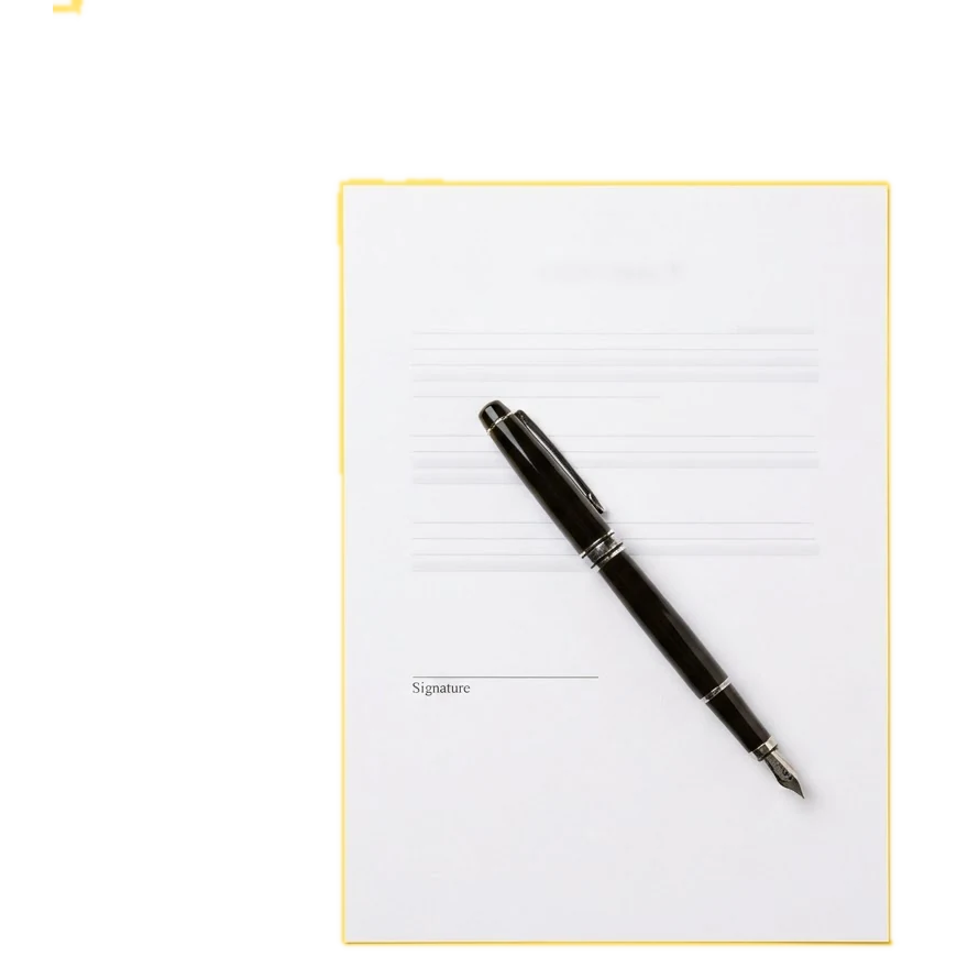 A fountain pen on a contract page on a yellow backdrop